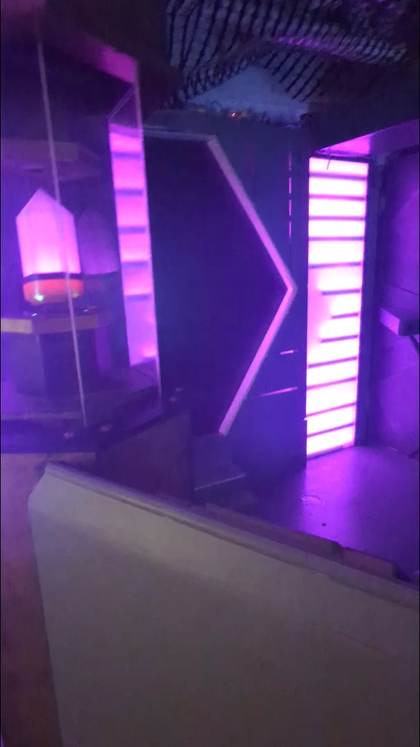 Purple-lit reactor chamber with a crystal enclosure.